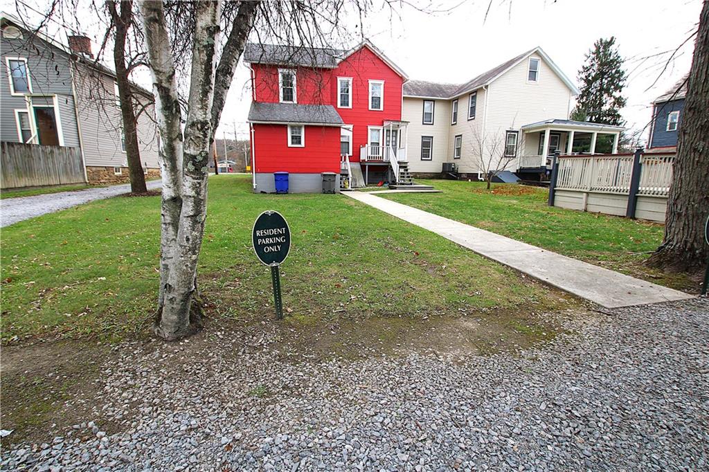 259 Mercer Street Harmony, PA 16037 - Photo 5 of 19 a sign board with garden in front of it