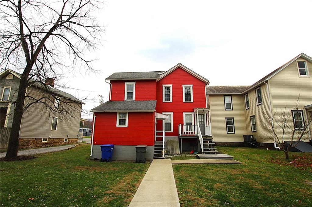 259 Mercer Street Harmony, PA 16037 - Photo 6 of 19 a front view of a house with a garden
