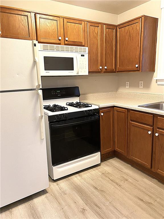 259 Mercer Street Harmony, PA 16037 - Photo 9 of 19 a kitchen with a stove and a microwave