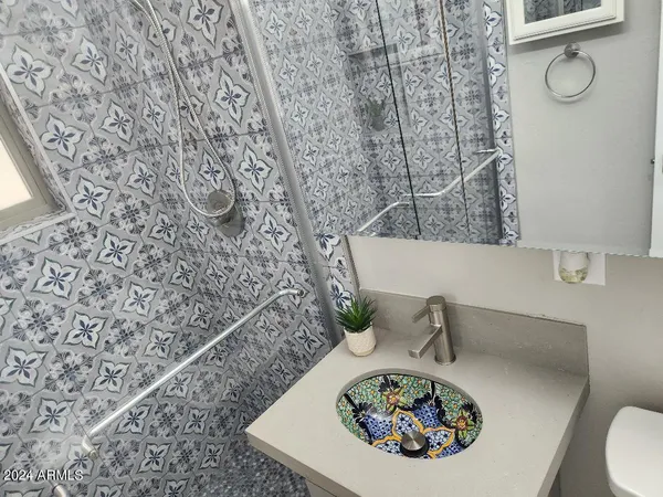a bathroom with a toilet and a sink