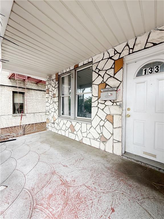 133 Quentin Road Brooklyn, NY 11223 - Photo 2 of 12 a view of a front door and a garage