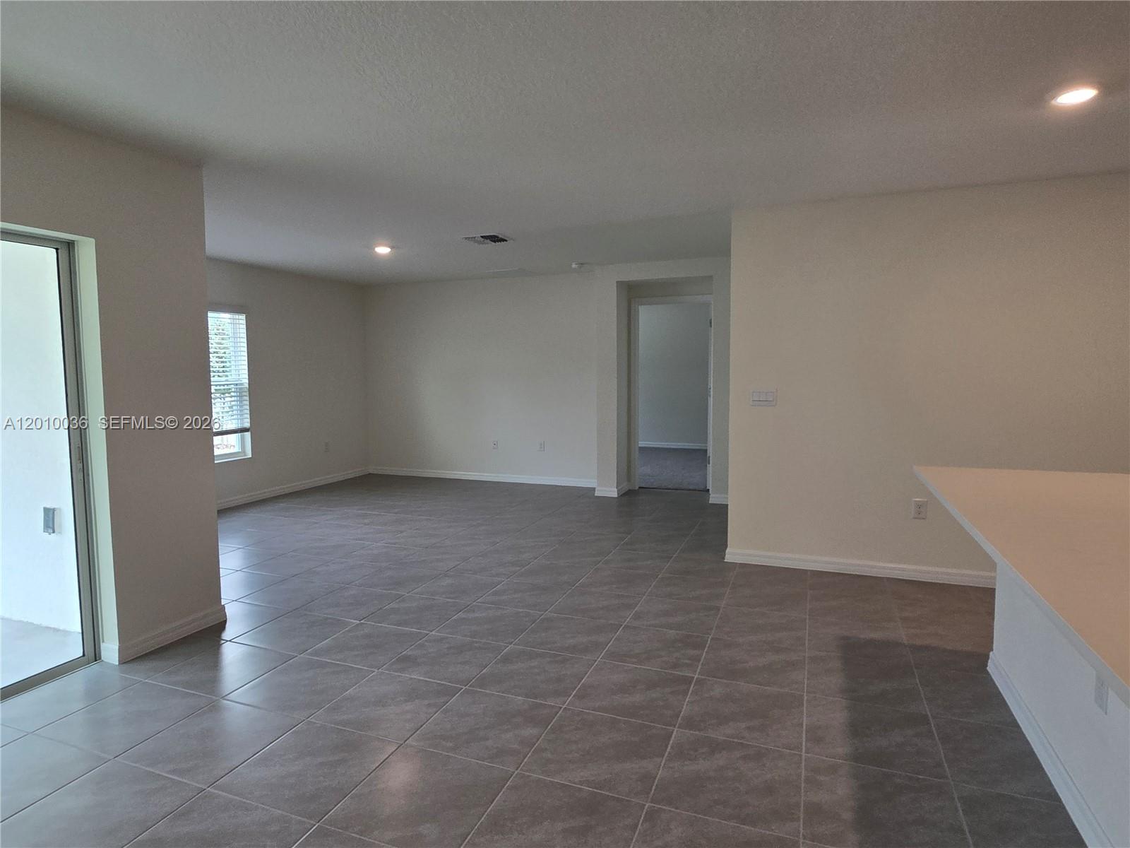 9871 Southeast 161st Lane Road Summerfield, FL 34491 - Photo 22 of 31 an empty room with windows