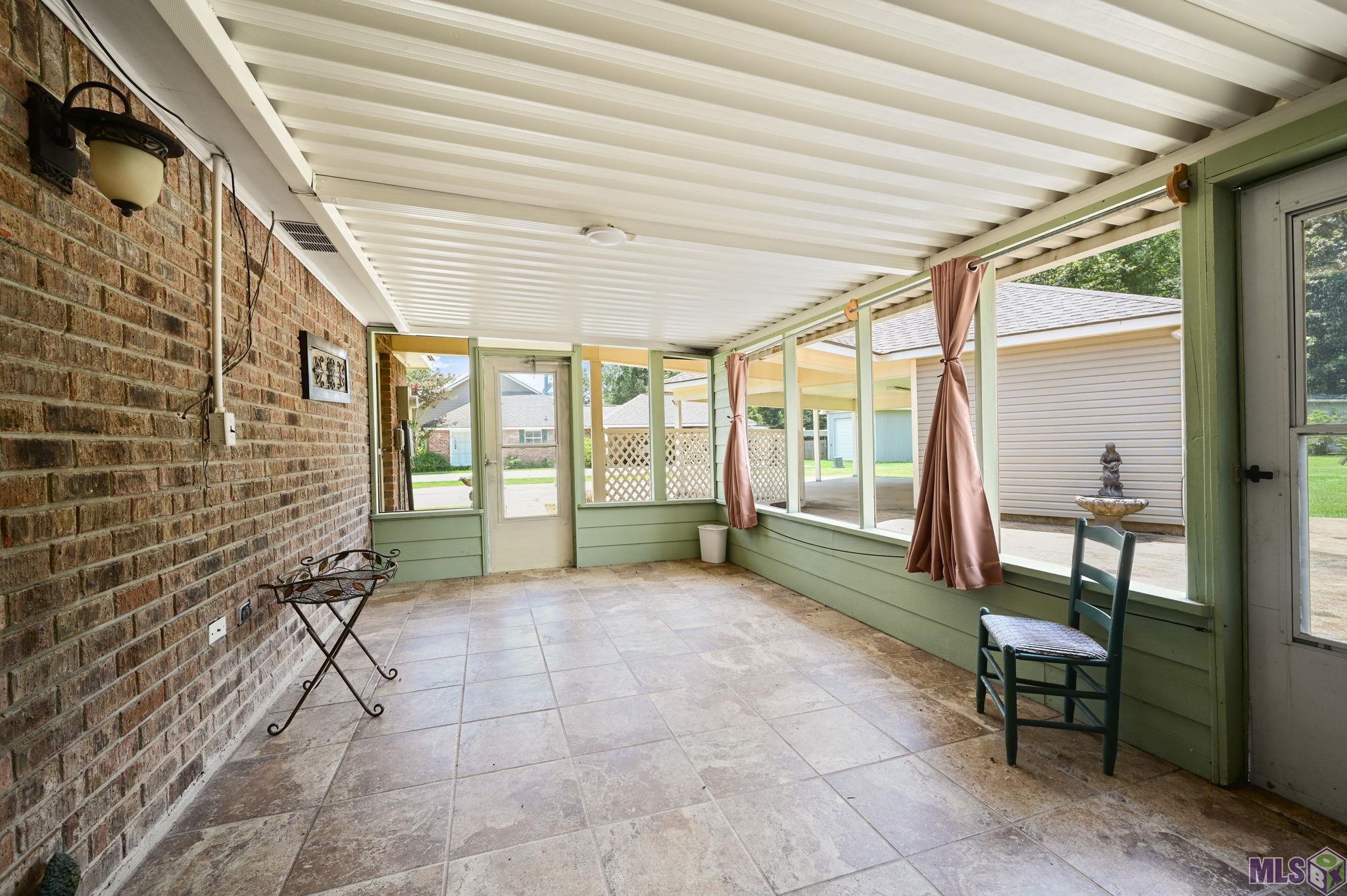 7097 Jim Rushing Road Denham Springs, LA 70706 - Photo 19 of 28 Very large screened in patio