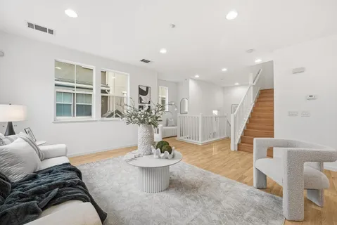 a living room with furniture and a table