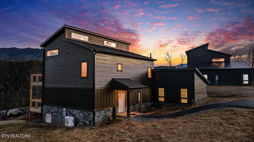 650 Ridge Top Loop Gatlinburg, TN 37738 - Photo 1 of 38 a front view of a house with garden