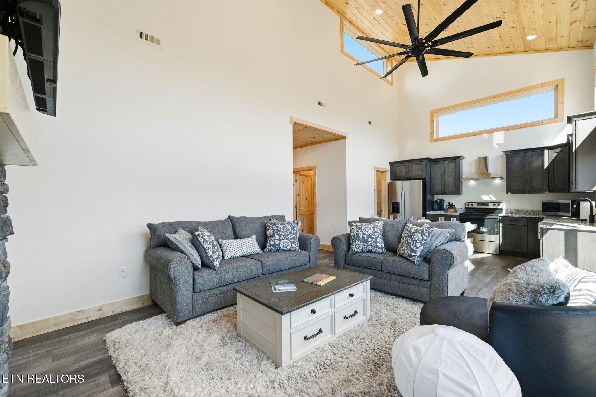 650 Ridge Top Loop Gatlinburg, TN 37738 - Photo 12 of 38 a living room with furniture a flat screen tv and a rug