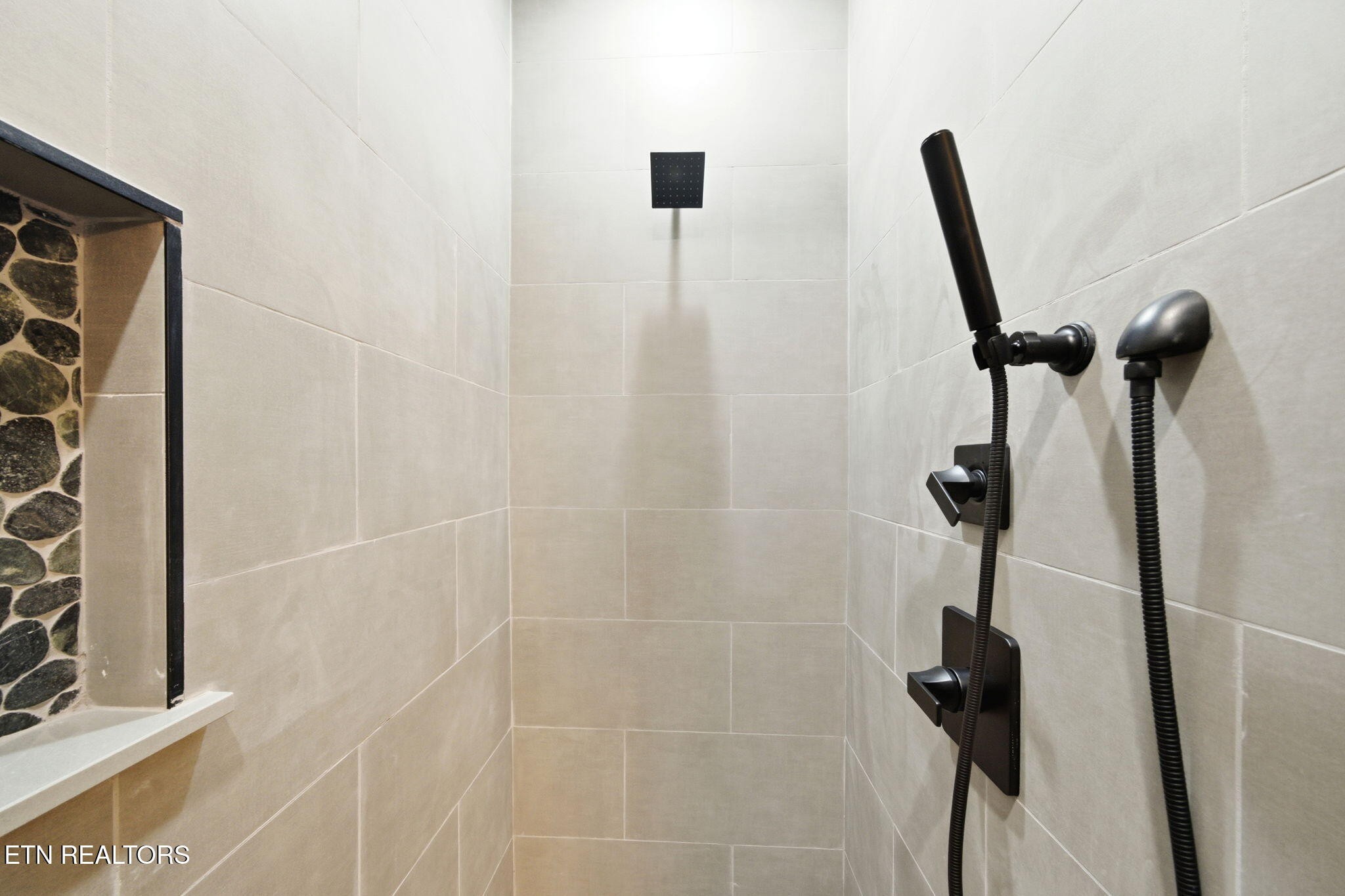 650 Ridge Top Loop Gatlinburg, TN 37738 - Photo 15 of 38 a bathroom with a shower