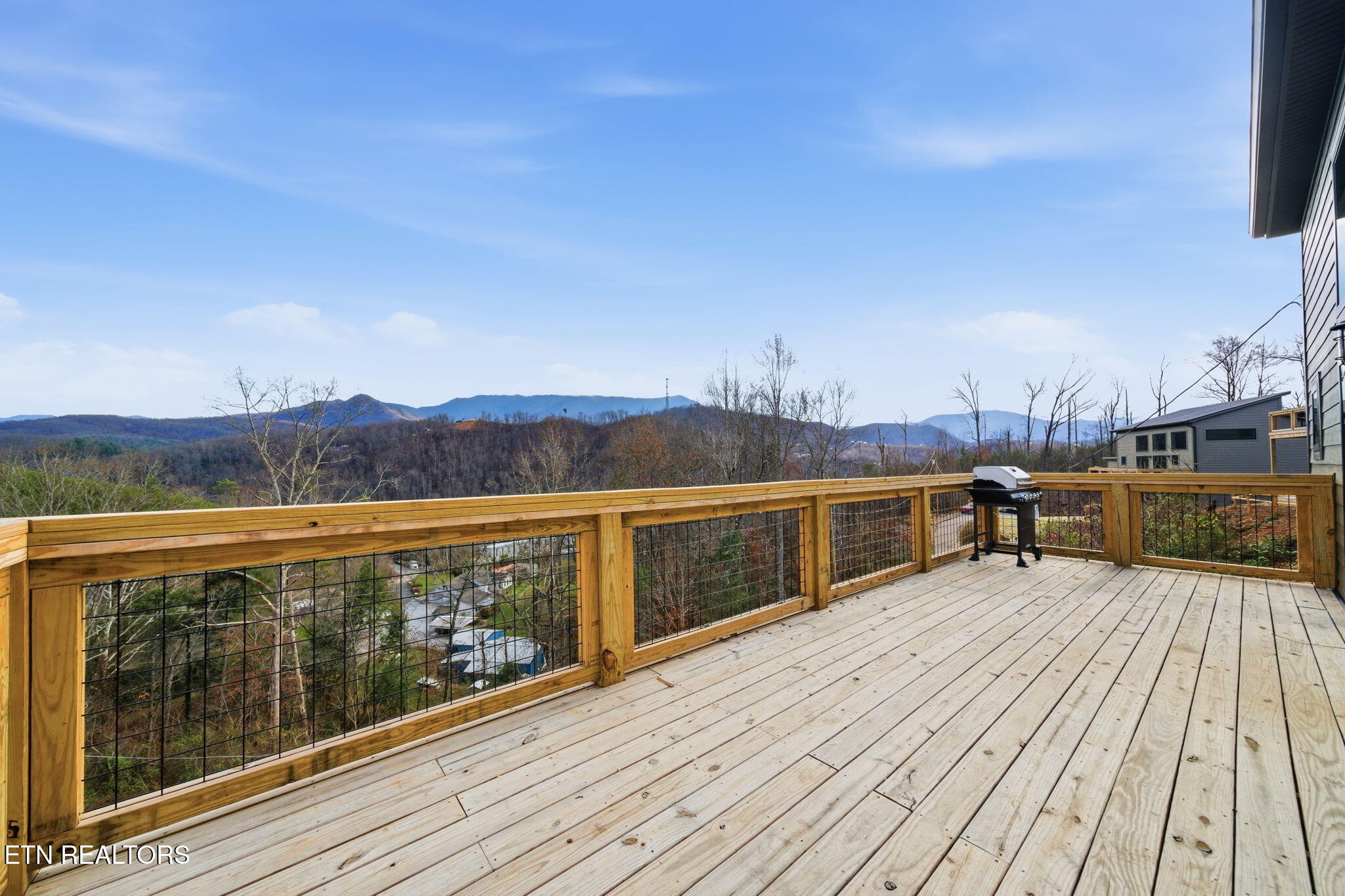 650 Ridge Top Loop Gatlinburg, TN 37738 - Photo 2 of 38 a view of a balcony with mountain view and wooden floor