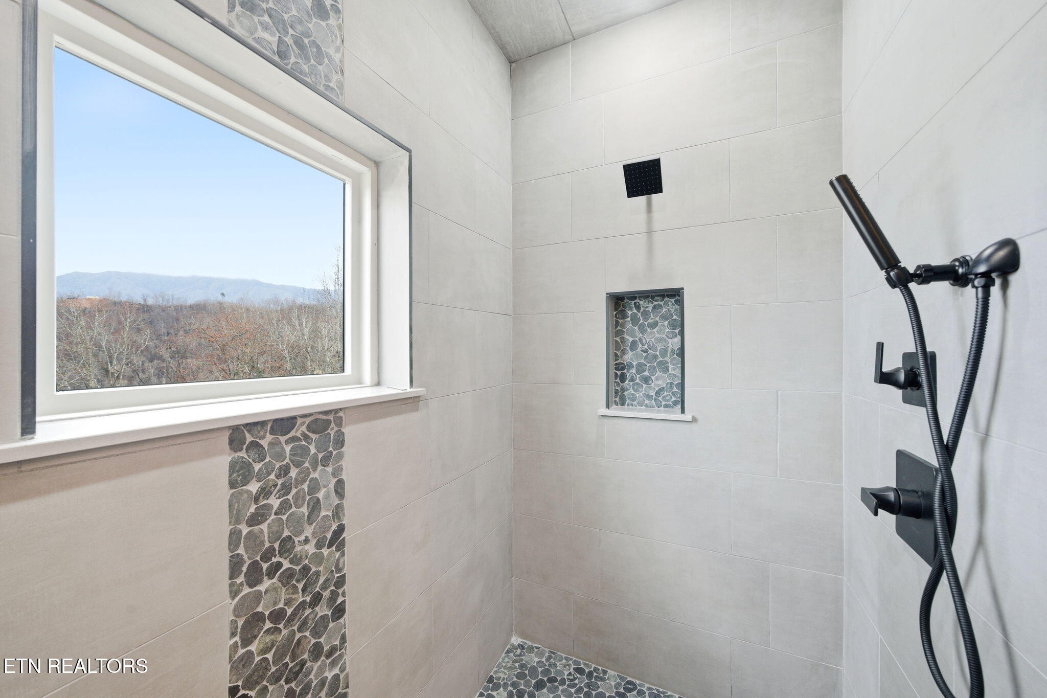 650 Ridge Top Loop Gatlinburg, TN 37738 - Photo 21 of 38 a bathroom with a shower