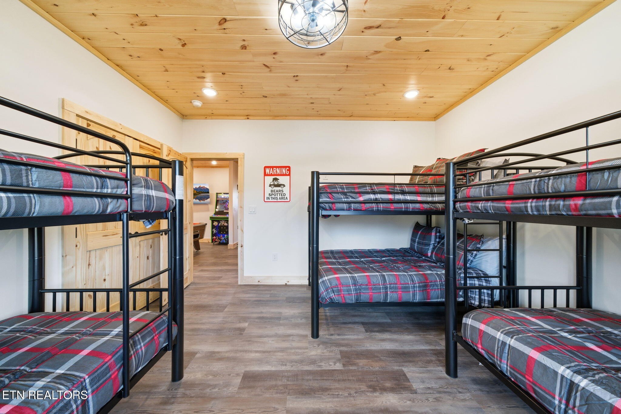 650 Ridge Top Loop Gatlinburg, TN 37738 - Photo 28 of 38 a bedroom with a bed and a chandelier