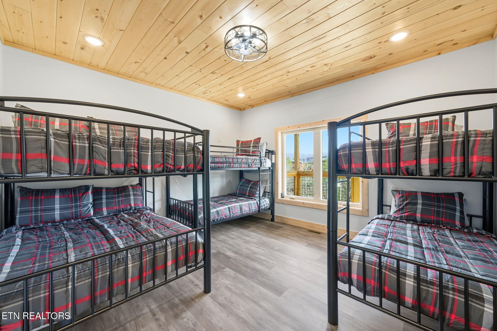 650 Ridge Top Loop Gatlinburg, TN 37738 - Photo 29 of 38 a bedroom with furniture and a window