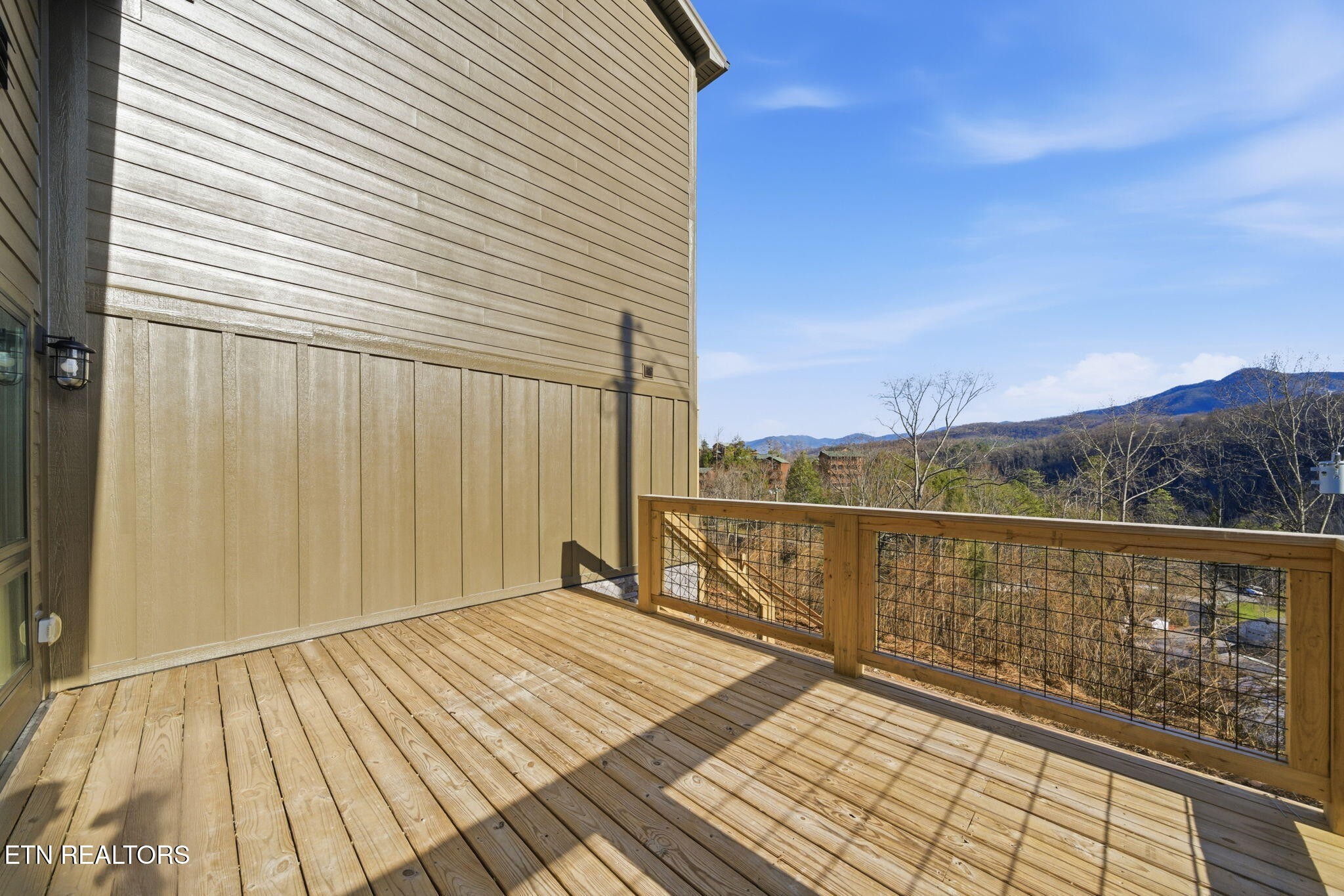 650 Ridge Top Loop Gatlinburg, TN 37738 - Photo 31 of 38 a view of balcony with wooden floor and fence