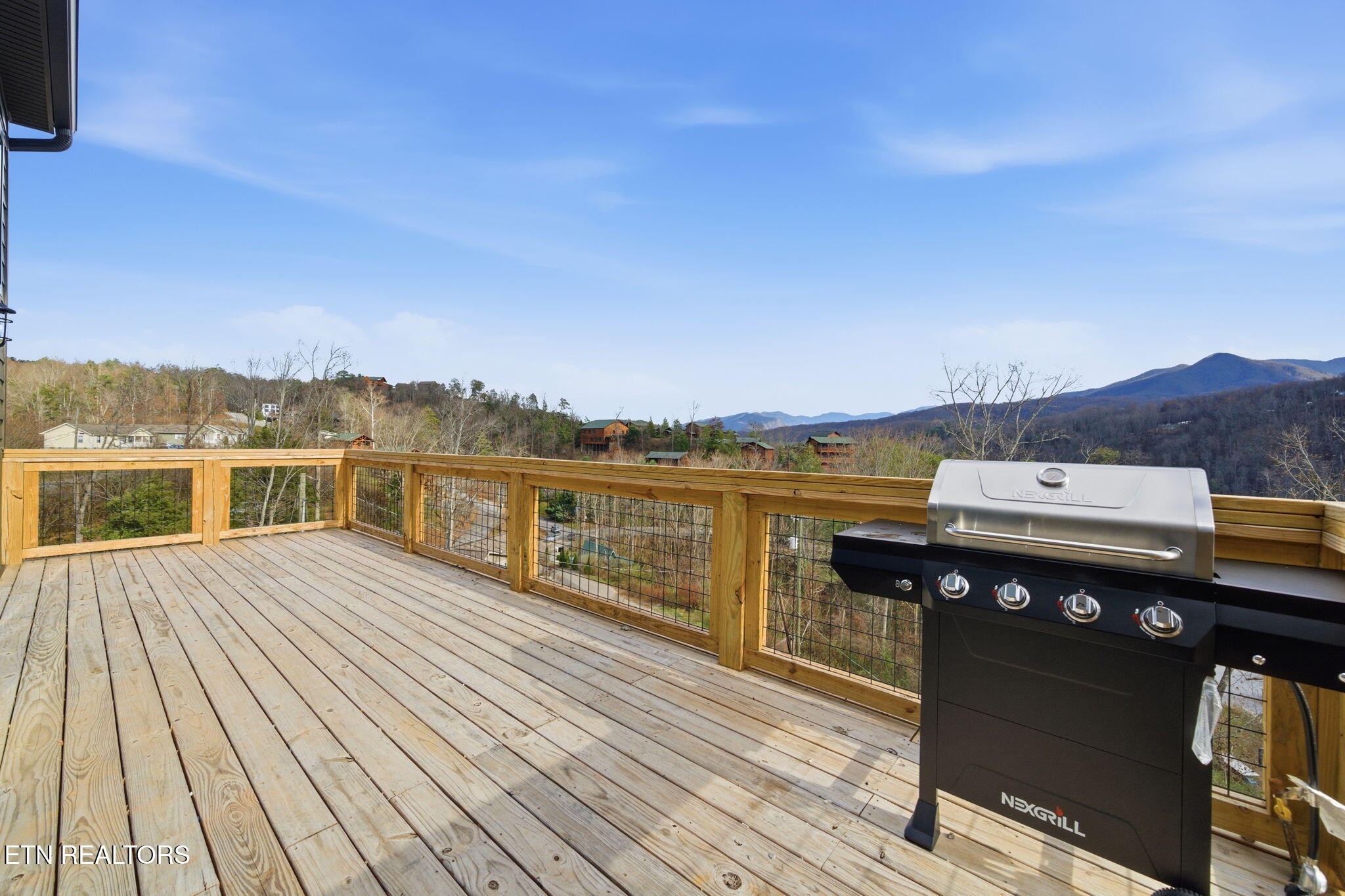 650 Ridge Top Loop Gatlinburg, TN 37738 - Photo 32 of 38 a view of a terrace with wooden floor and city view