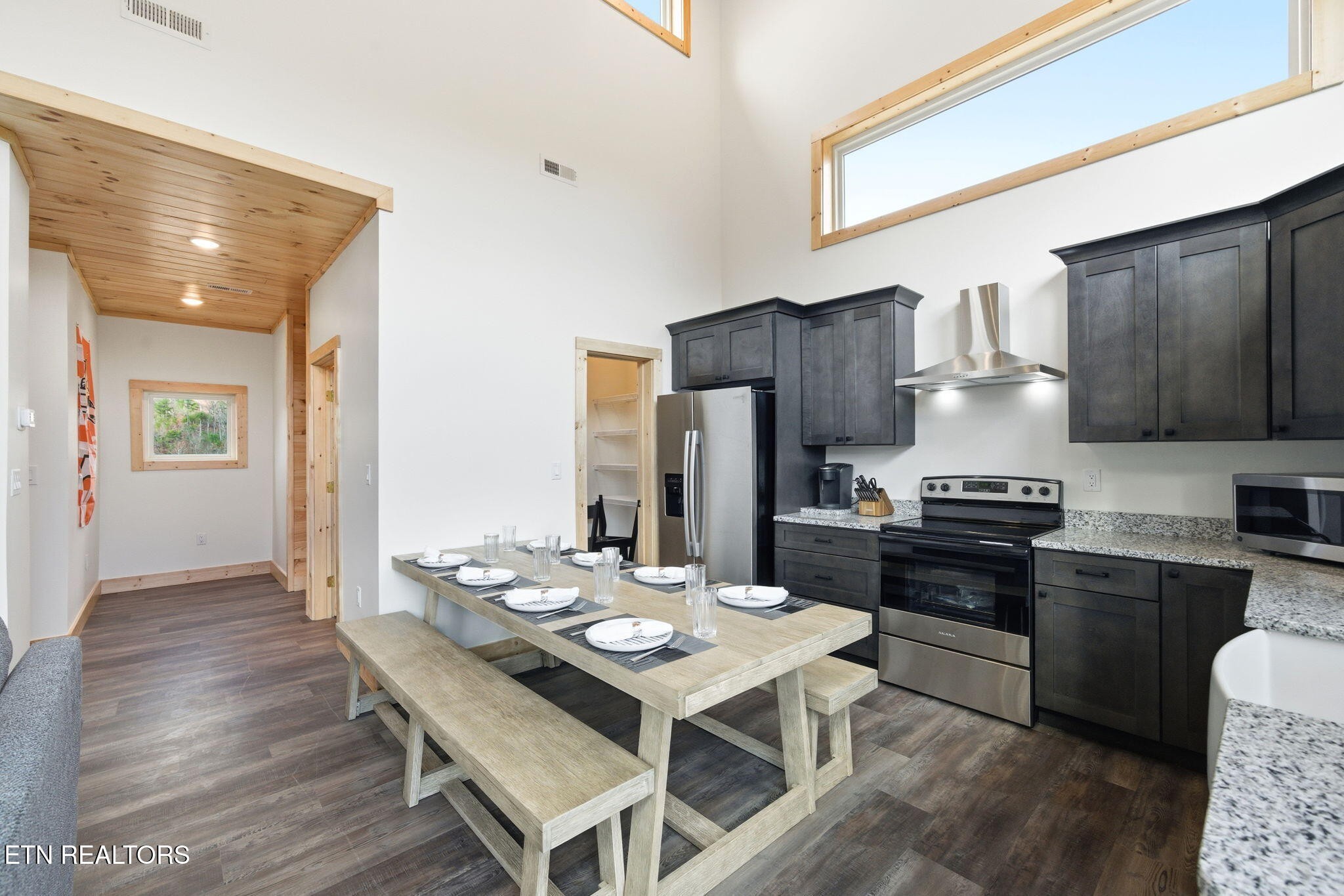 650 Ridge Top Loop Gatlinburg, TN 37738 - Photo 10 of 38 a kitchen with granite countertop a sink appliances and wooden floor