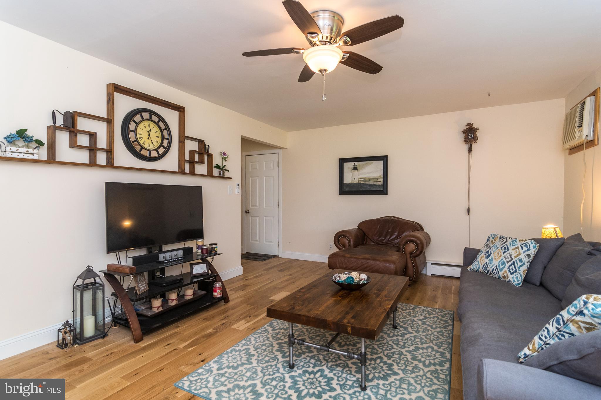 1495 Cocalico Road Birdsboro, PA 19508 - Photo 5 of 40 Living Room with garage door & kitchen entry