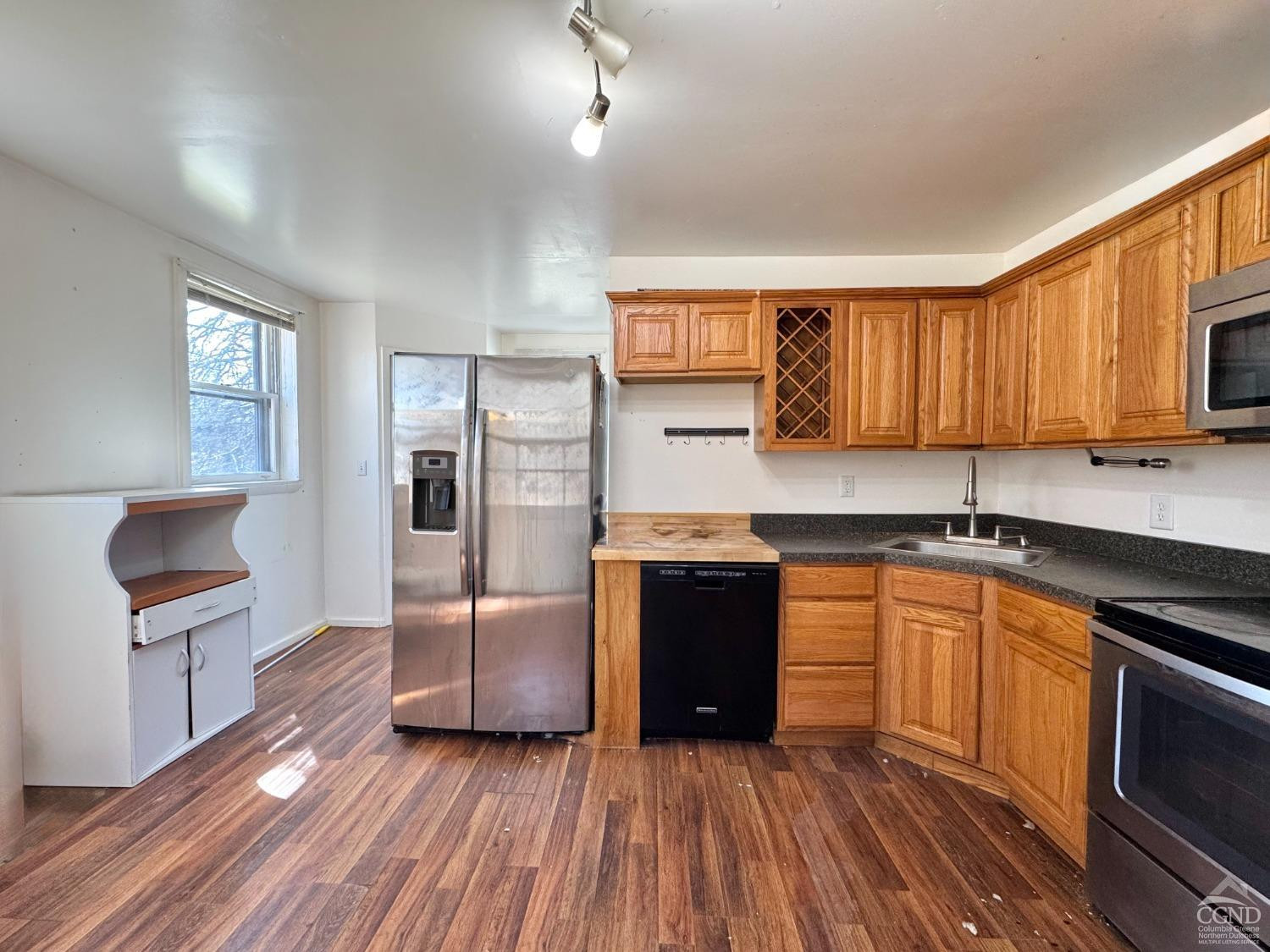 357 Highway 385 Athens, NY 12414 - Photo 11 of 22 a kitchen with granite countertop a refrigerator and a stove top oven