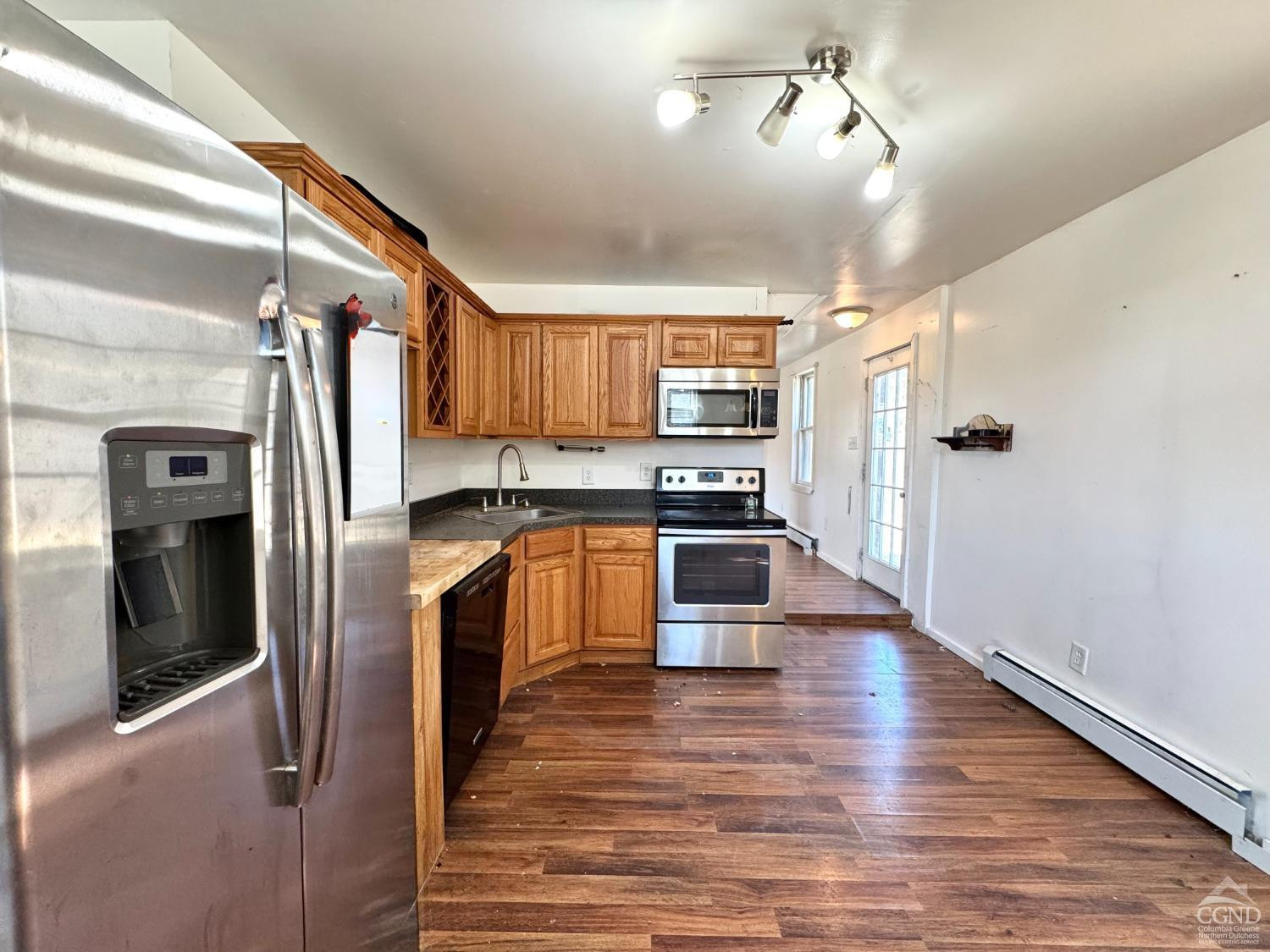 357 Highway 385 Athens, NY 12414 - Photo 12 of 22 a kitchen with stainless steel appliances a refrigerator sink and cabinets