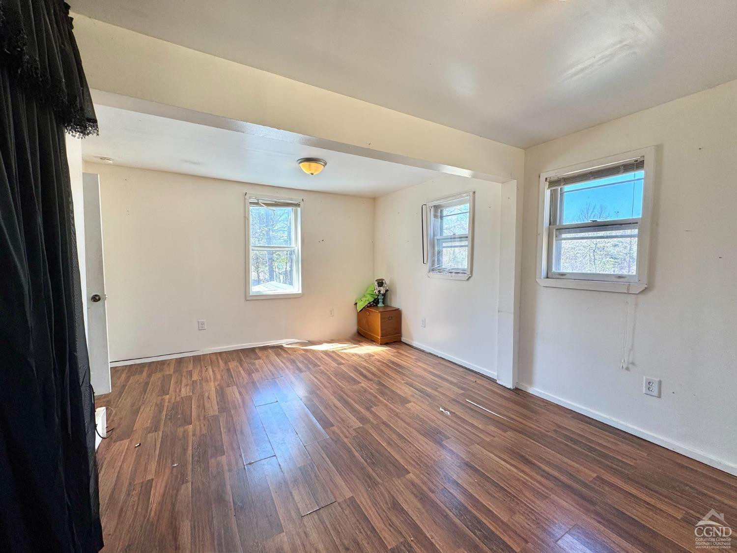 357 Highway 385 Athens, NY 12414 - Photo 13 of 22 a view of empty room with wooden floor and fan