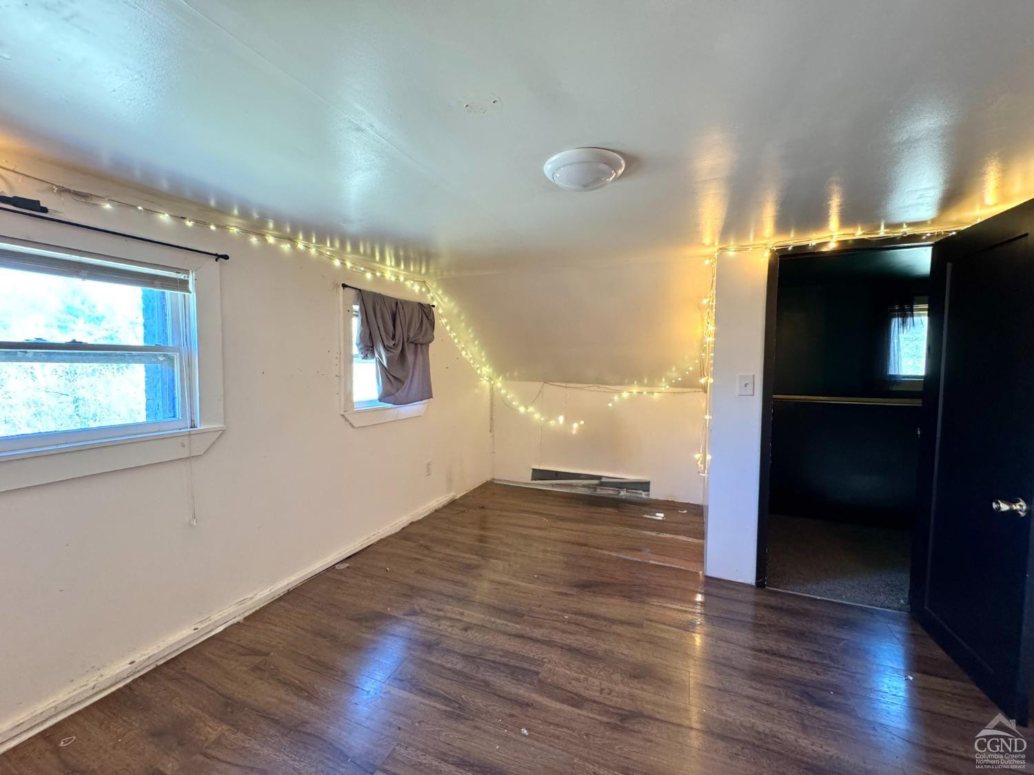 357 Highway 385 Athens, NY 12414 - Photo 16 of 22 a view of an empty room with wooden floor and a window