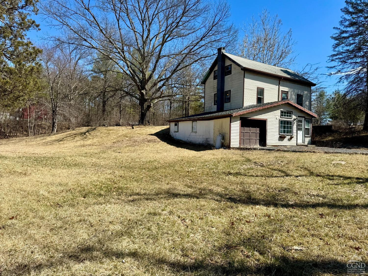 357 Highway 385 Athens, NY 12414 - Photo 4 of 22 a white house that has tree in front of it