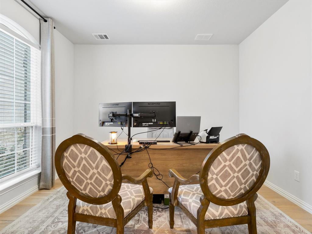 2156 Cloverfern Way Haslet, TX 76052 - Photo 16 of 40 a view of a dining room with furniture and wooden floor