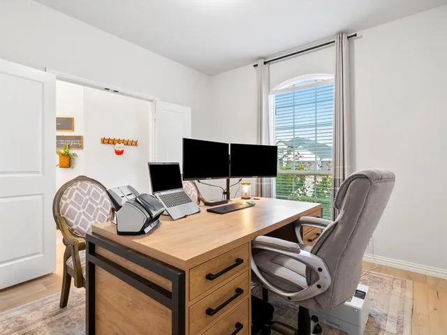 a view of a workspace with furniture