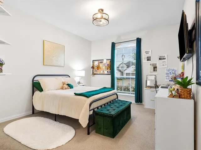 a view of a livingroom with furniture and a flat screen tv