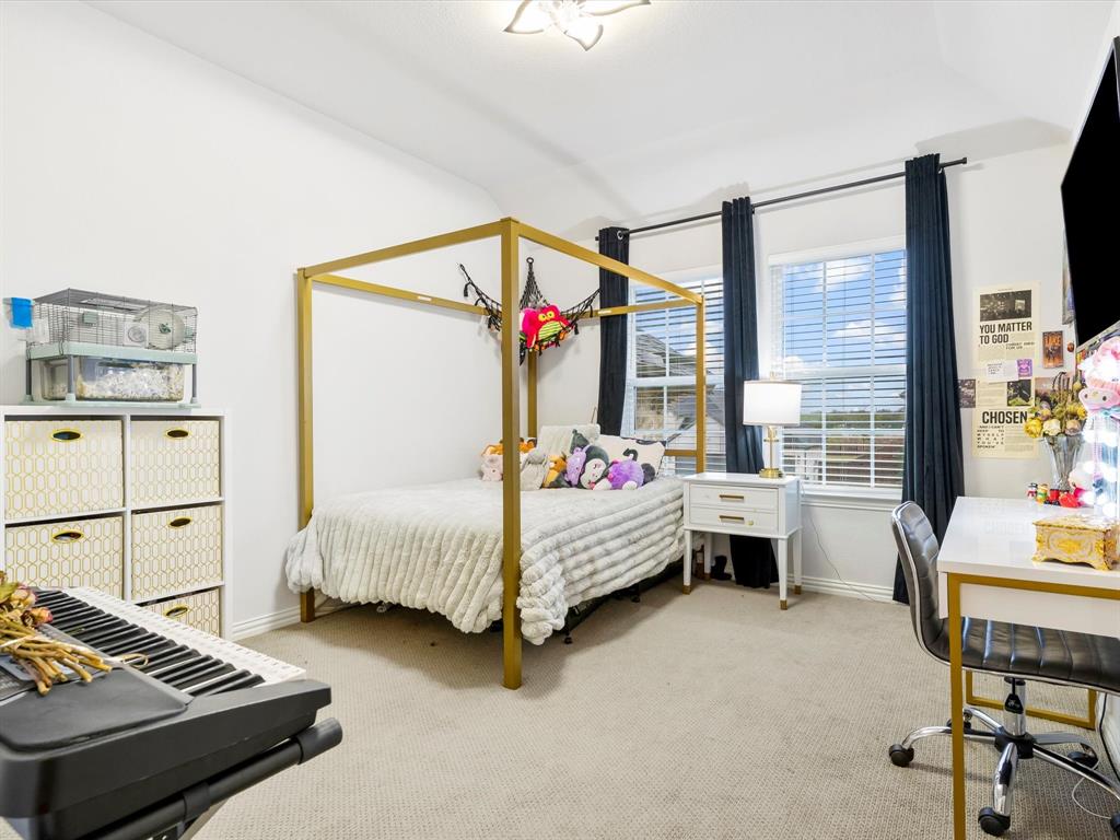 2156 Cloverfern Way Haslet, TX 76052 - Photo 32 of 40 a bedroom with bed and window