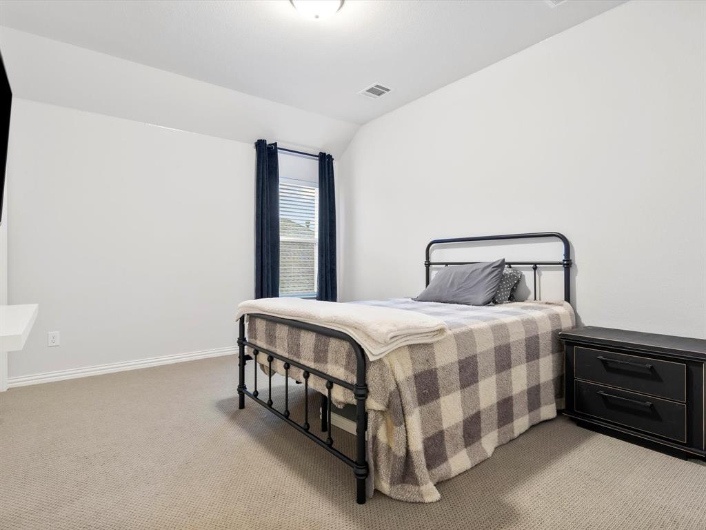 2156 Cloverfern Way Haslet, TX 76052 - Photo 34 of 40 a bedroom with a bed and a window