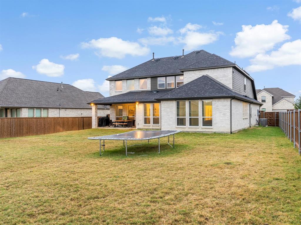 2156 Cloverfern Way Haslet, TX 76052 - Photo 38 of 40 a front view of a house with swimming pool having outdoor seating