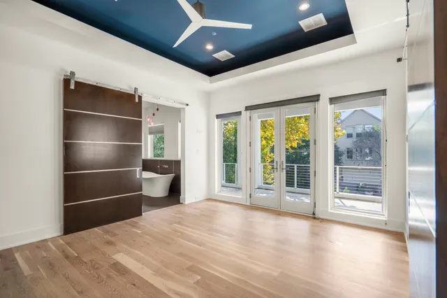 a bathroom with a sink mirror and toilet