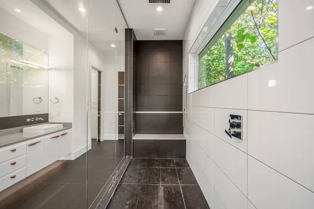 a kitchen with a sink appliances and cabinets