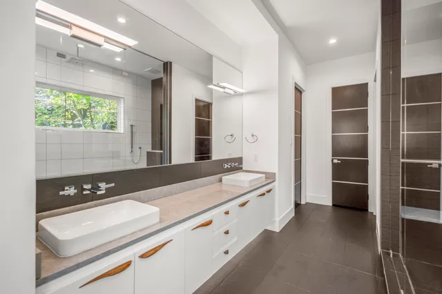 a large bathroom with a large tub and sink
