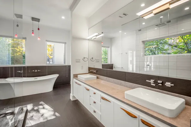 a view of a hallway with white walls and stairs