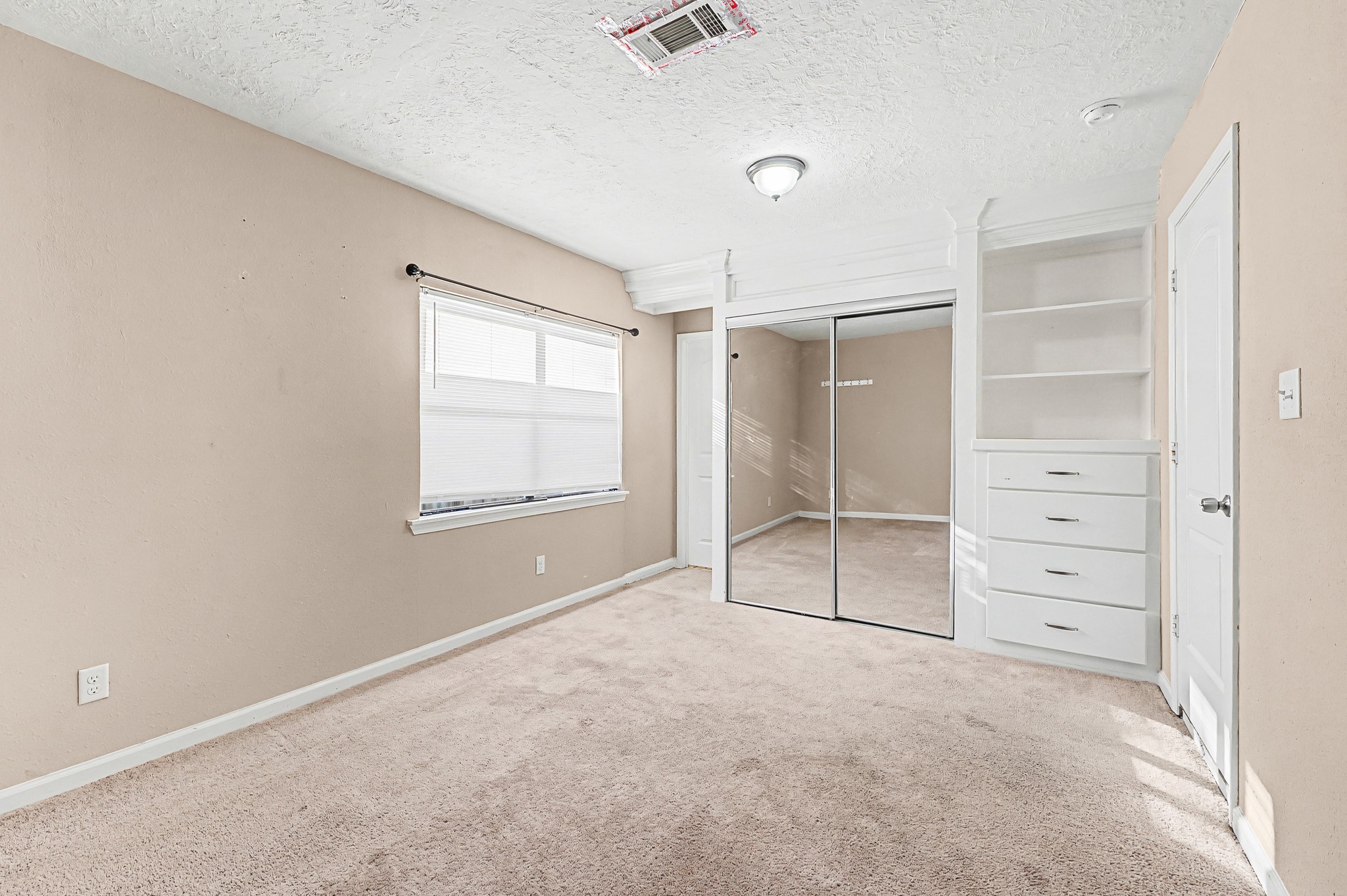 823 Marleen Street Houston, TX 77034 - Photo 11 of 15 an empty room with closet and windows