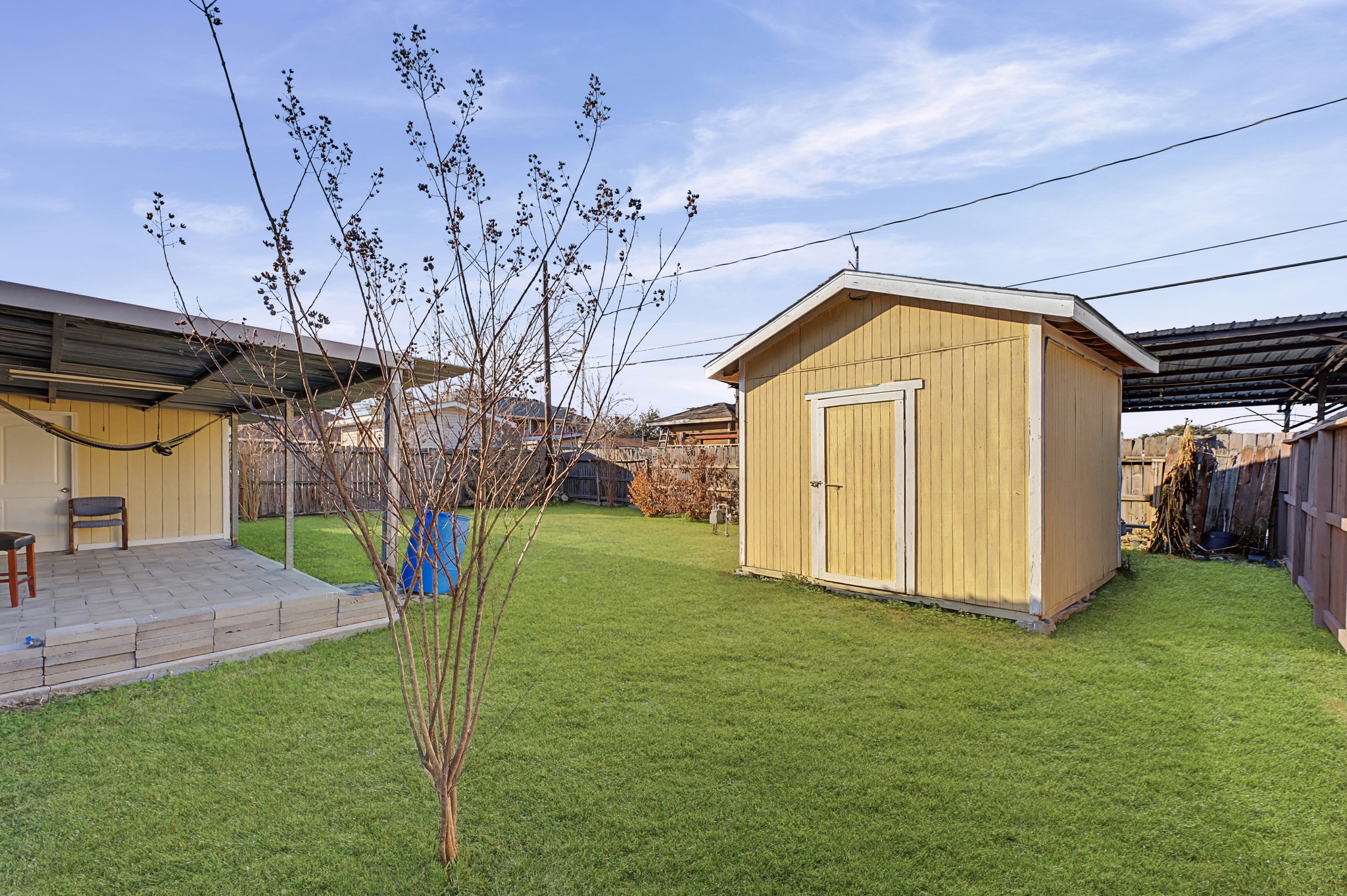 823 Marleen Street Houston, TX 77034 - Photo 13 of 15 a view of a backyard with a small cabin
