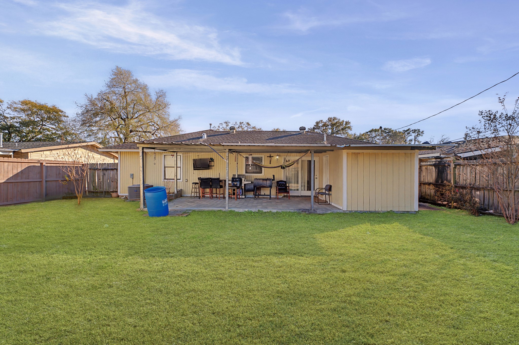 823 Marleen Street Houston, TX 77034 - Photo 14 of 15 a view of a house with backyard porch and garden