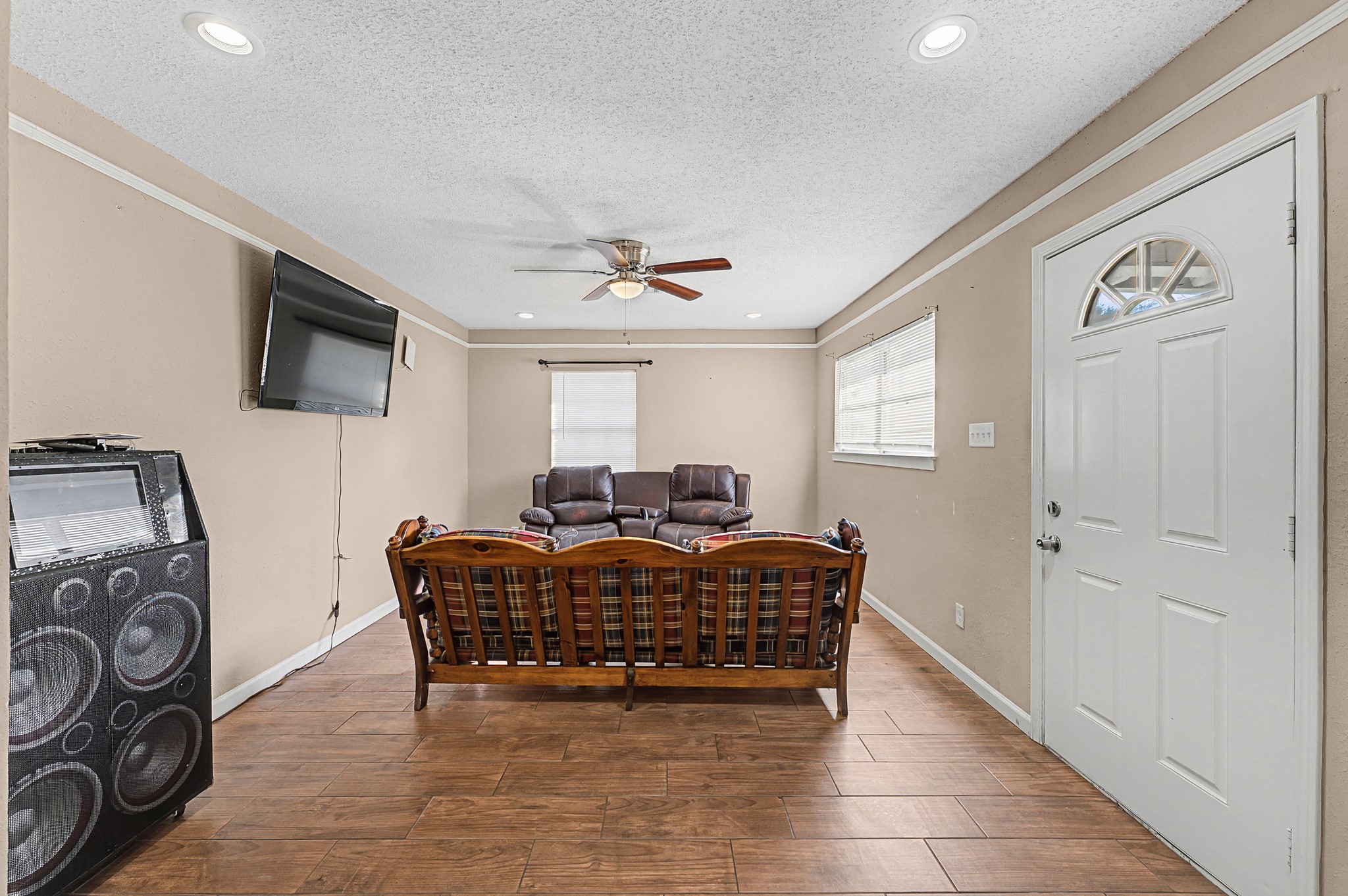 823 Marleen Street Houston, TX 77034 - Photo 3 of 15 a living room with furniture a window and a flat screen tv