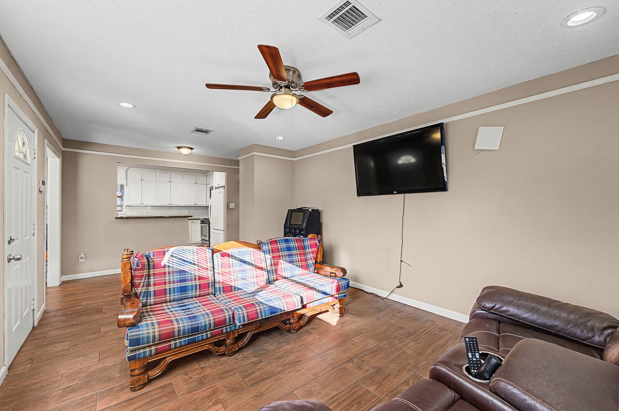 823 Marleen Street Houston, TX 77034 - Photo 4 of 15 a bedroom with a bed and a flat screen tv