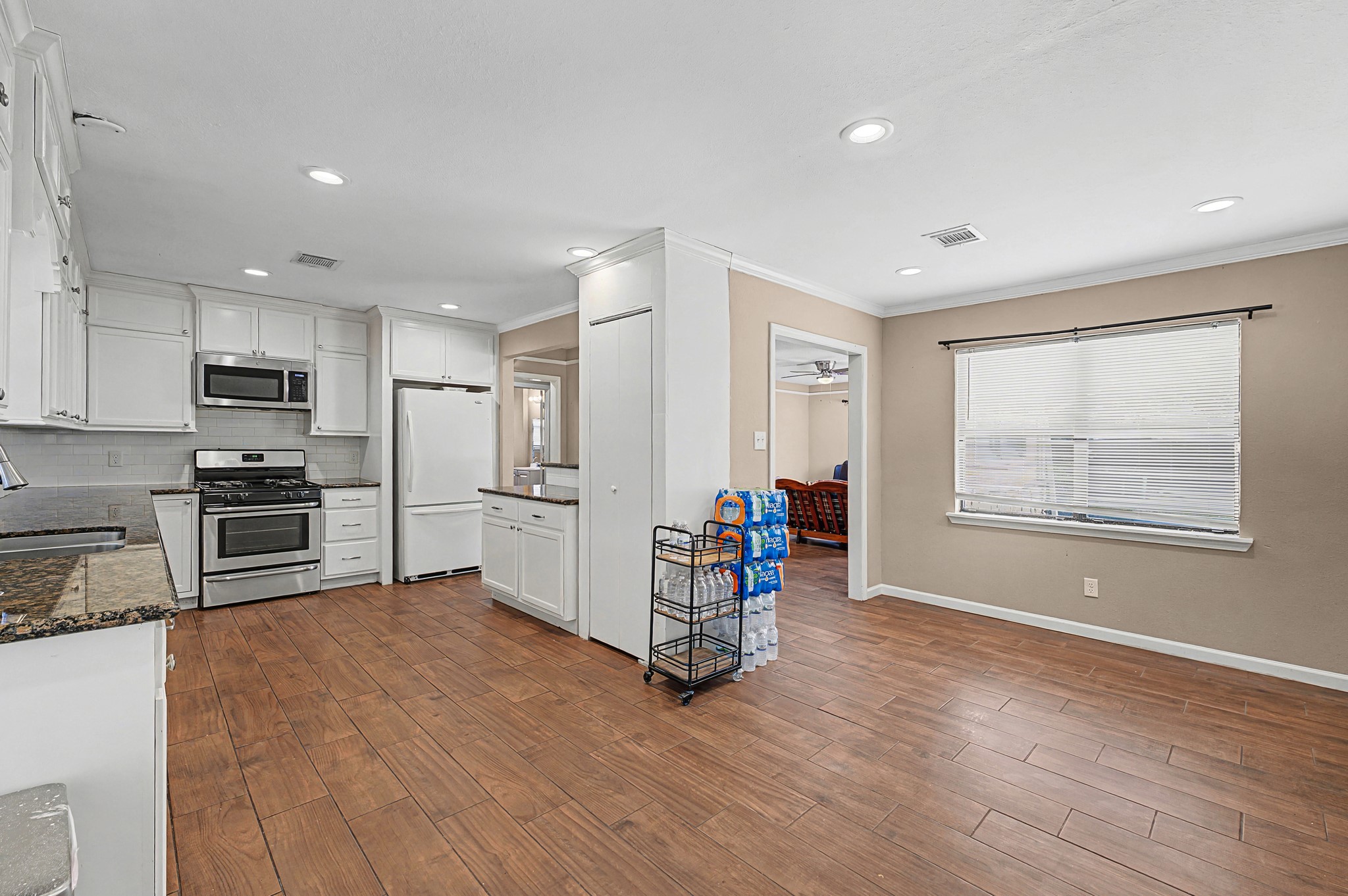 823 Marleen Street Houston, TX 77034 - Photo 8 of 15 a kitchen with stainless steel appliances a refrigerator and a stove top oven