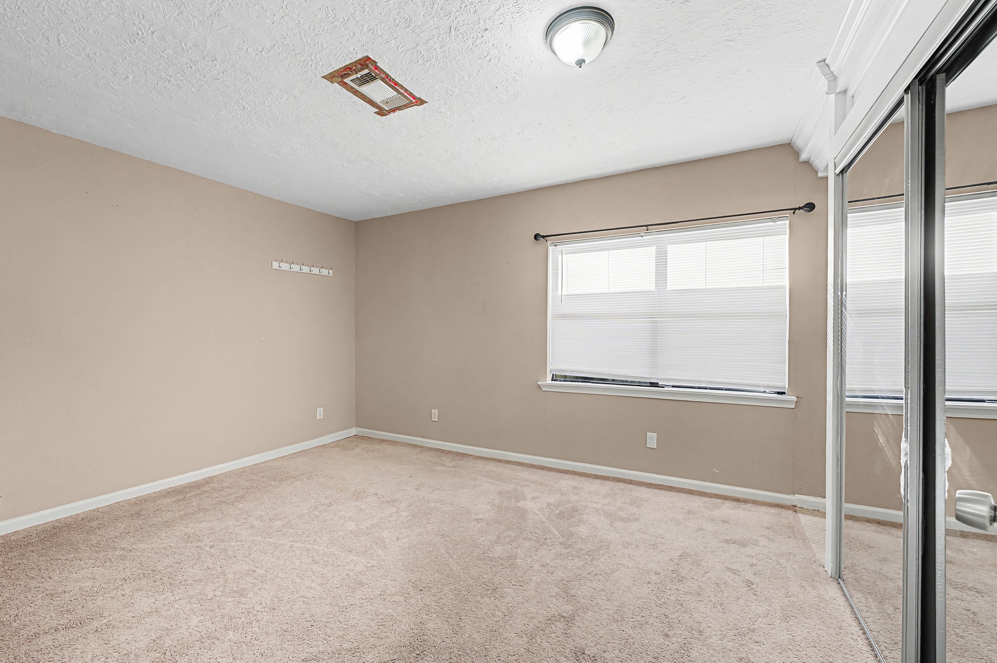 823 Marleen Street Houston, TX 77034 - Photo 9 of 15 a view of an empty room with a window
