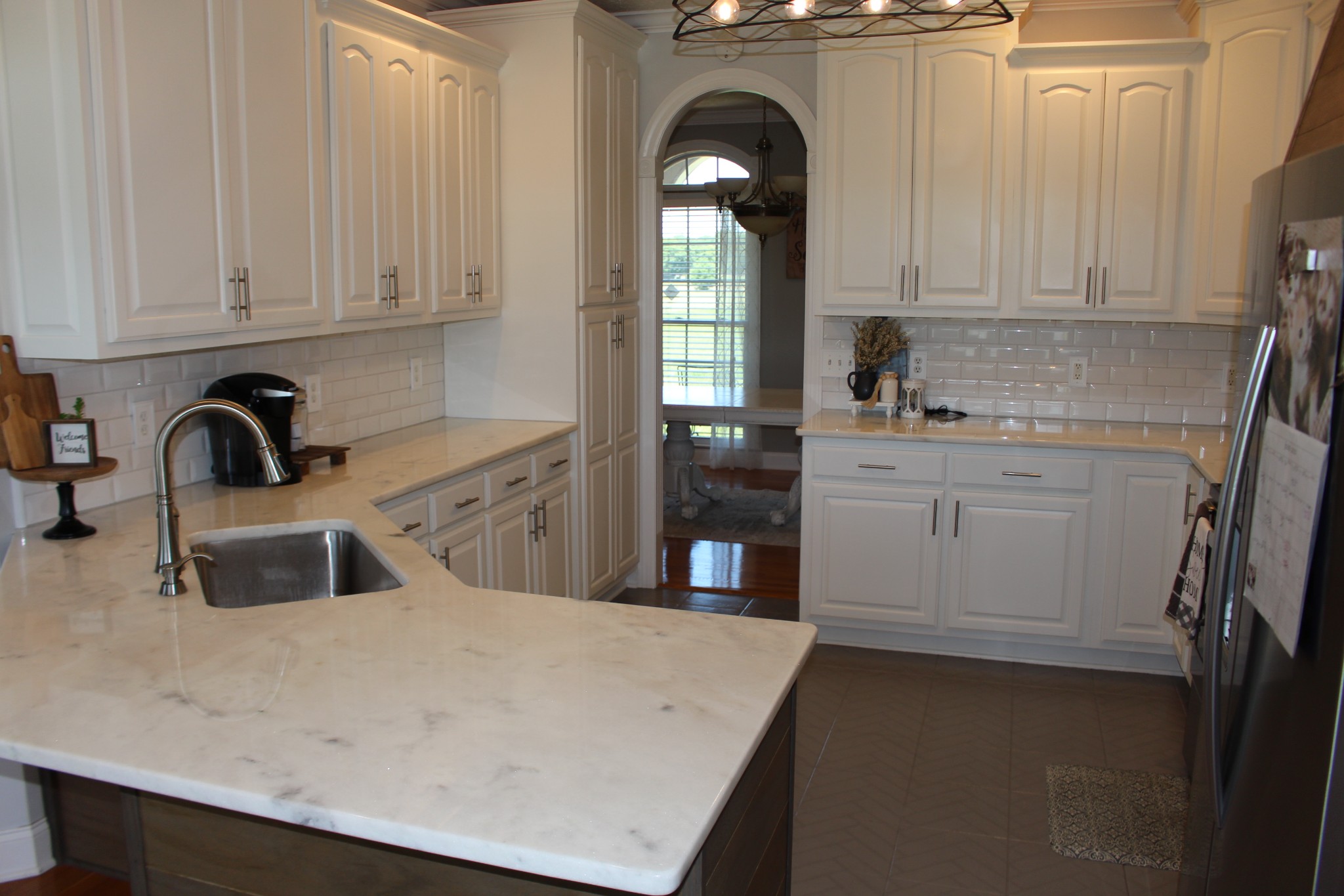 2707 Sixteenth Model Road Manchester, TN 37355 - Photo 14 of 50 a kitchen with white cabinets a sink and dishwasher