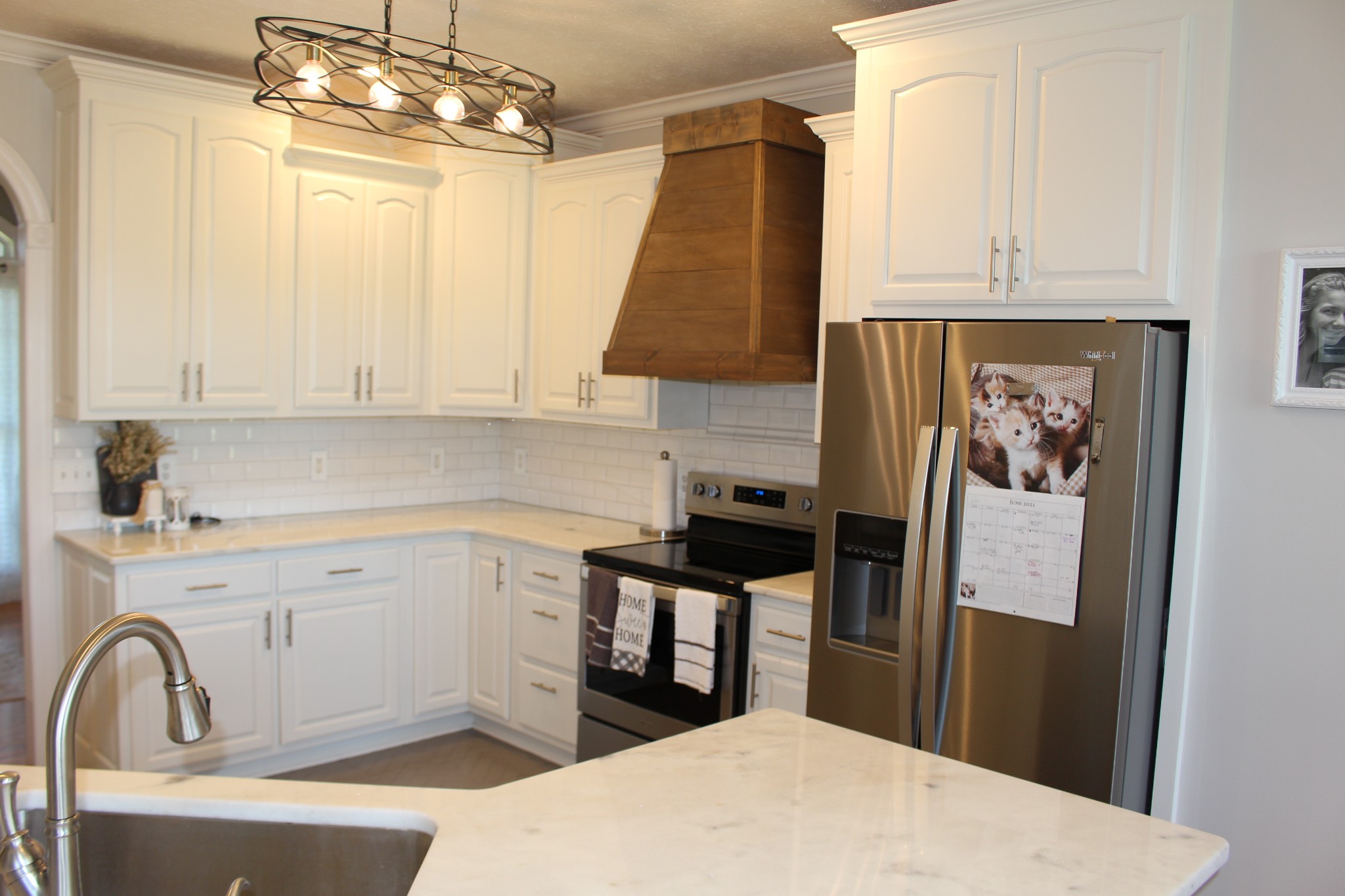 2707 Sixteenth Model Road Manchester, TN 37355 - Photo 15 of 50 a kitchen with a sink a refrigerator and cabinets