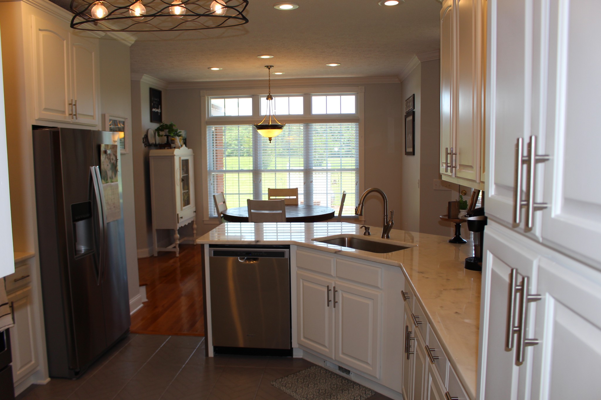 2707 Sixteenth Model Road Manchester, TN 37355 - Photo 16 of 50 a kitchen with stainless steel appliances granite countertop a refrigerator and a sink