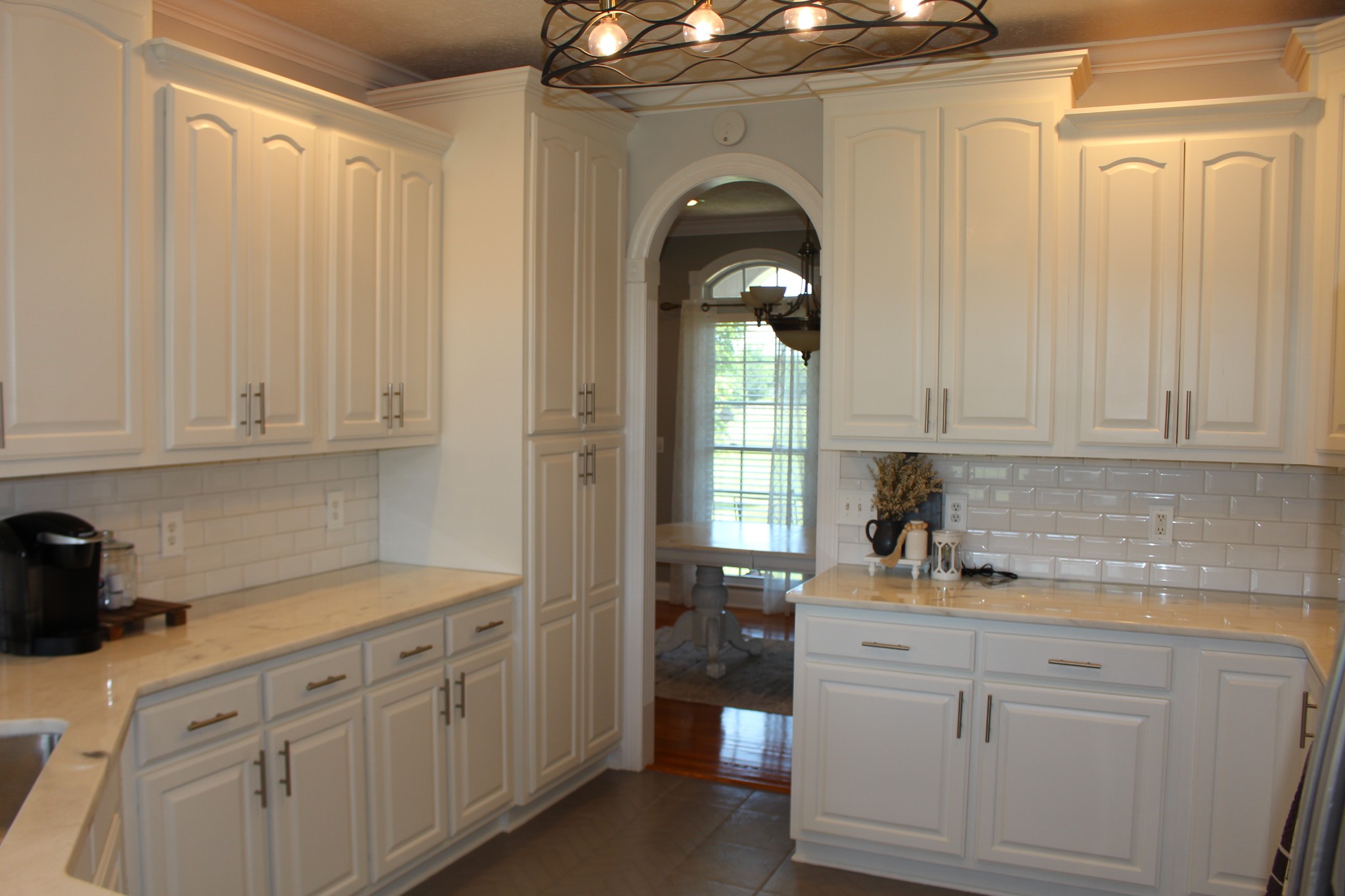 2707 Sixteenth Model Road Manchester, TN 37355 - Photo 17 of 50 a kitchen with white cabinets and sink