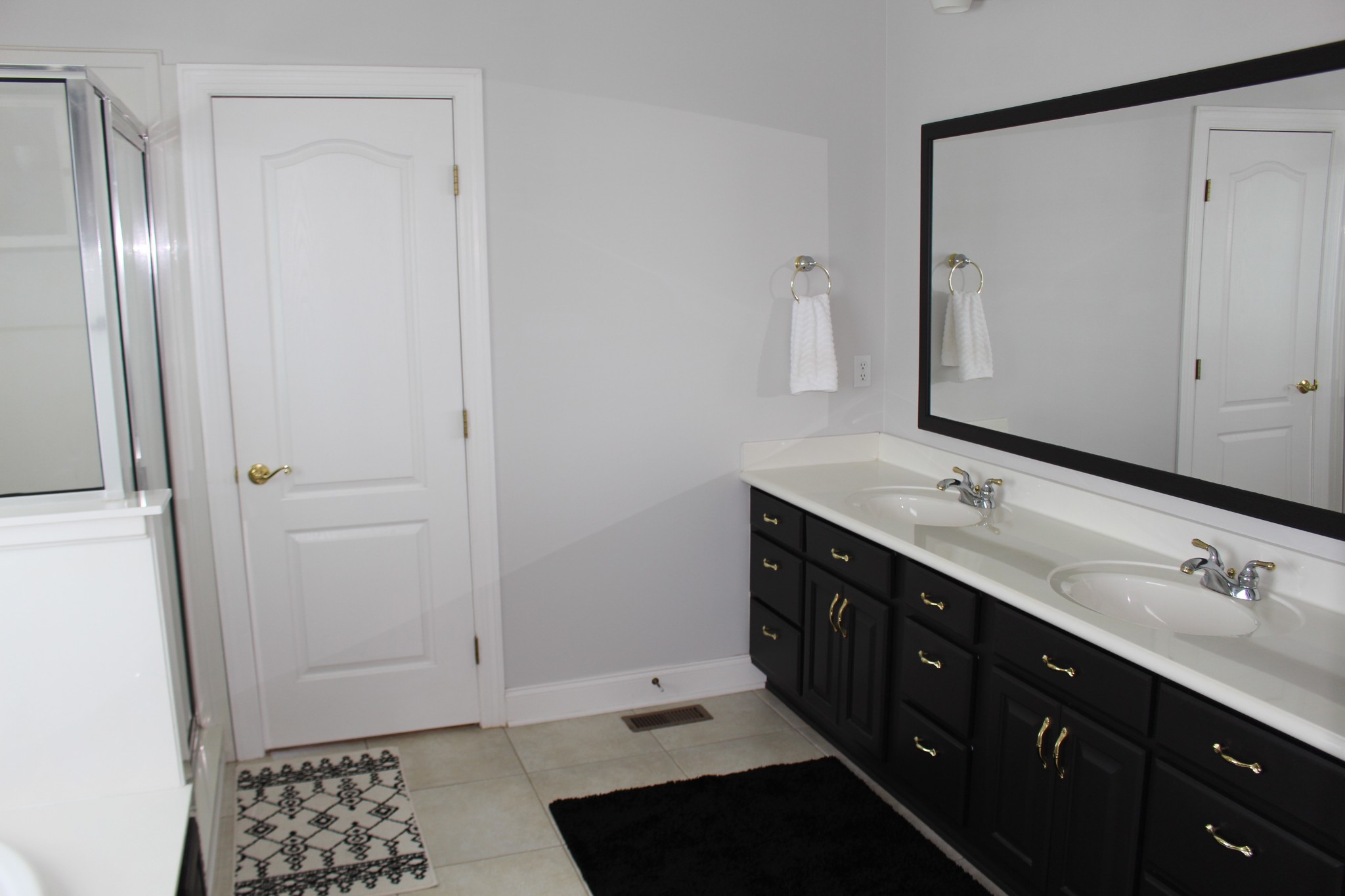 2707 Sixteenth Model Road Manchester, TN 37355 - Photo 26 of 50 a bathroom with a double vanity sink a and mirror