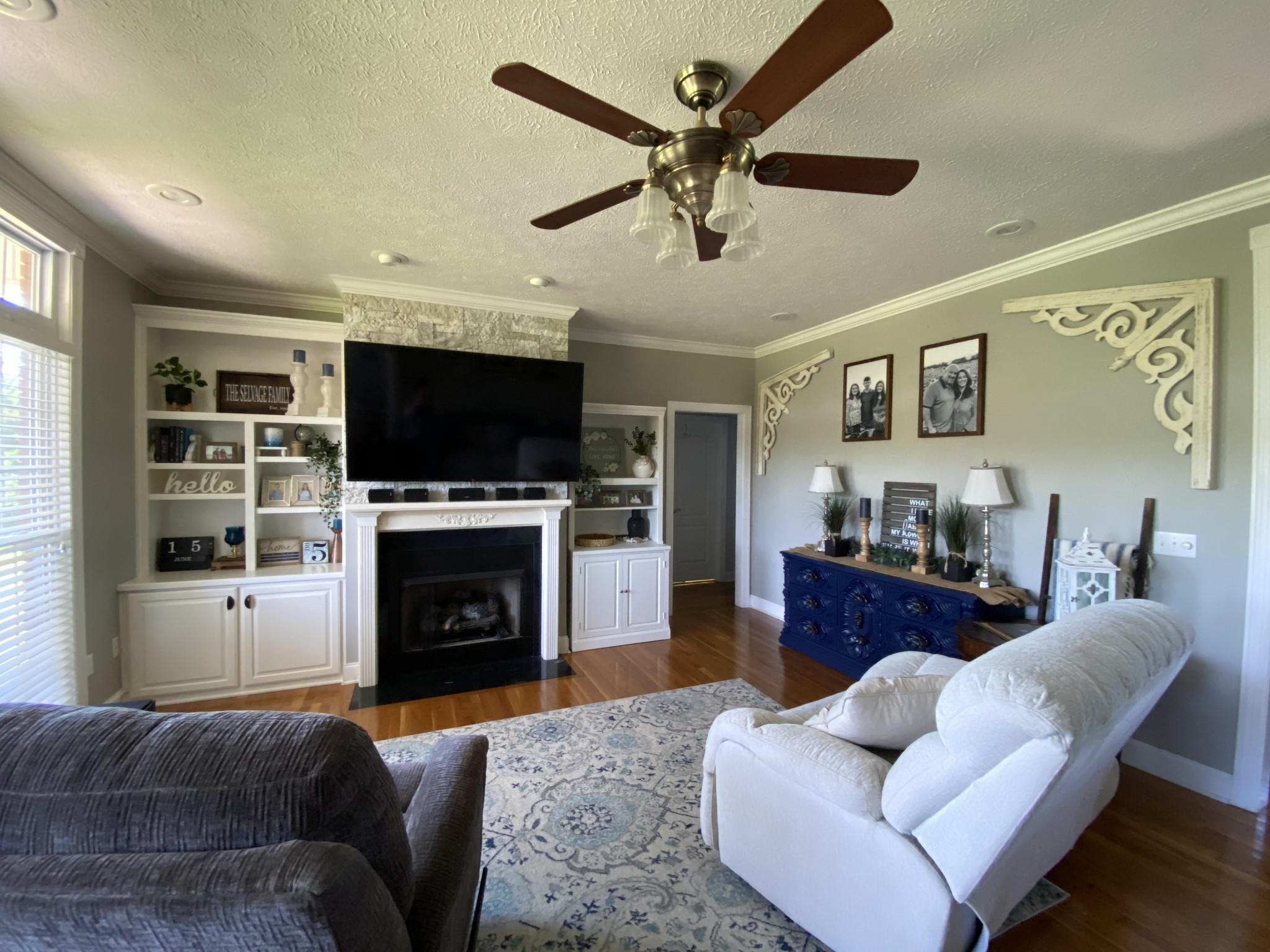 2707 Sixteenth Model Road Manchester, TN 37355 - Photo 6 of 50 a living room with furniture a flat screen tv and a fireplace