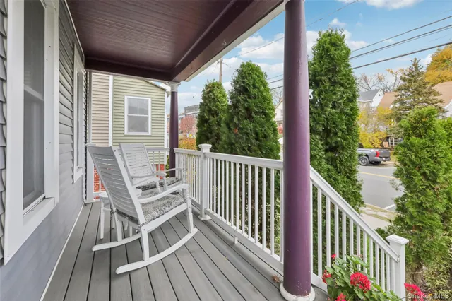 a view of balcony with furniture