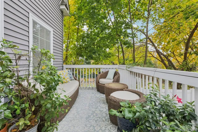 a view of a chair and table in the balcony