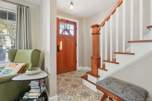 a view of a bedroom with furniture and window